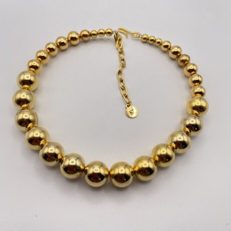 Collier rigide perle dorée